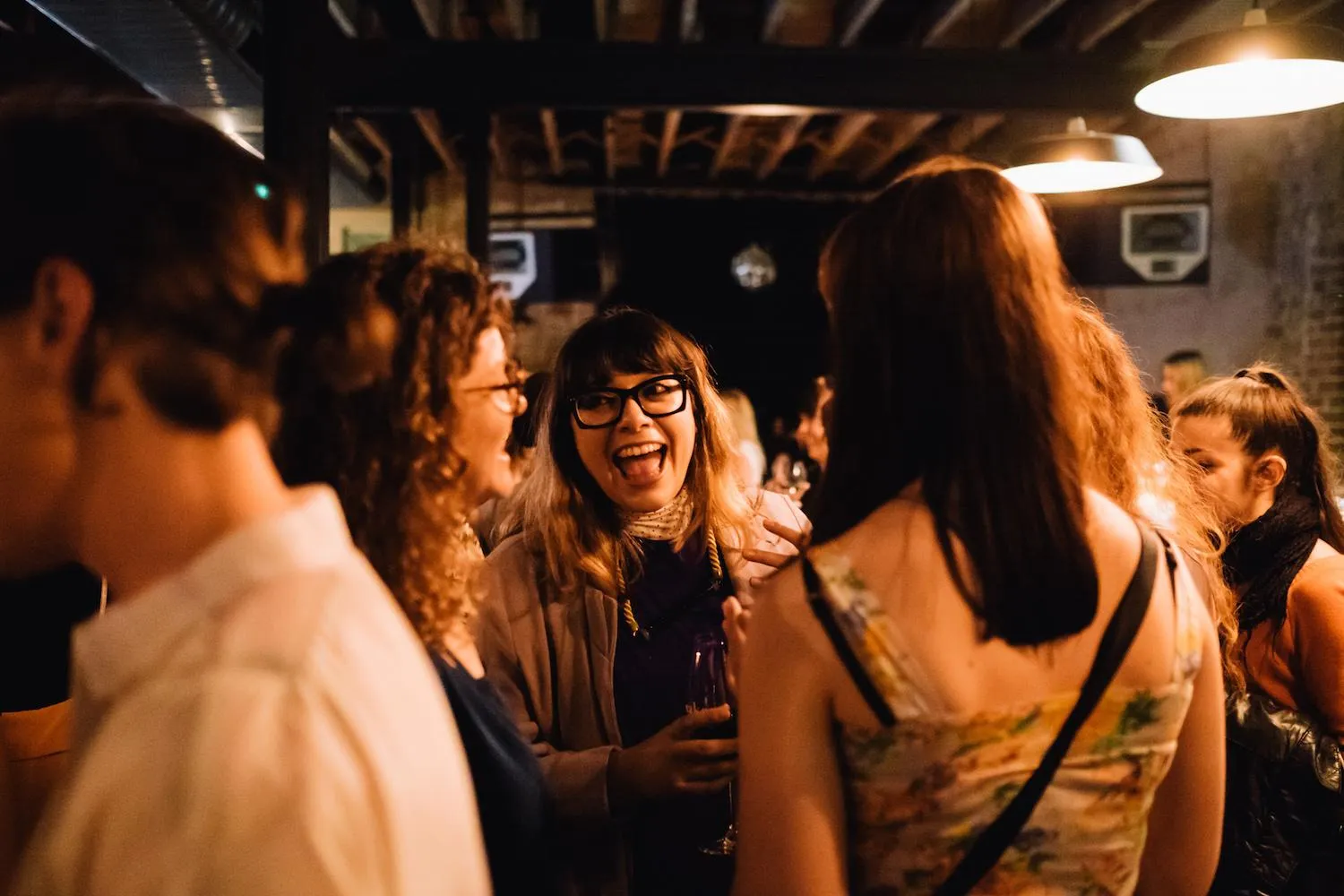 Conference attendees happily network at event