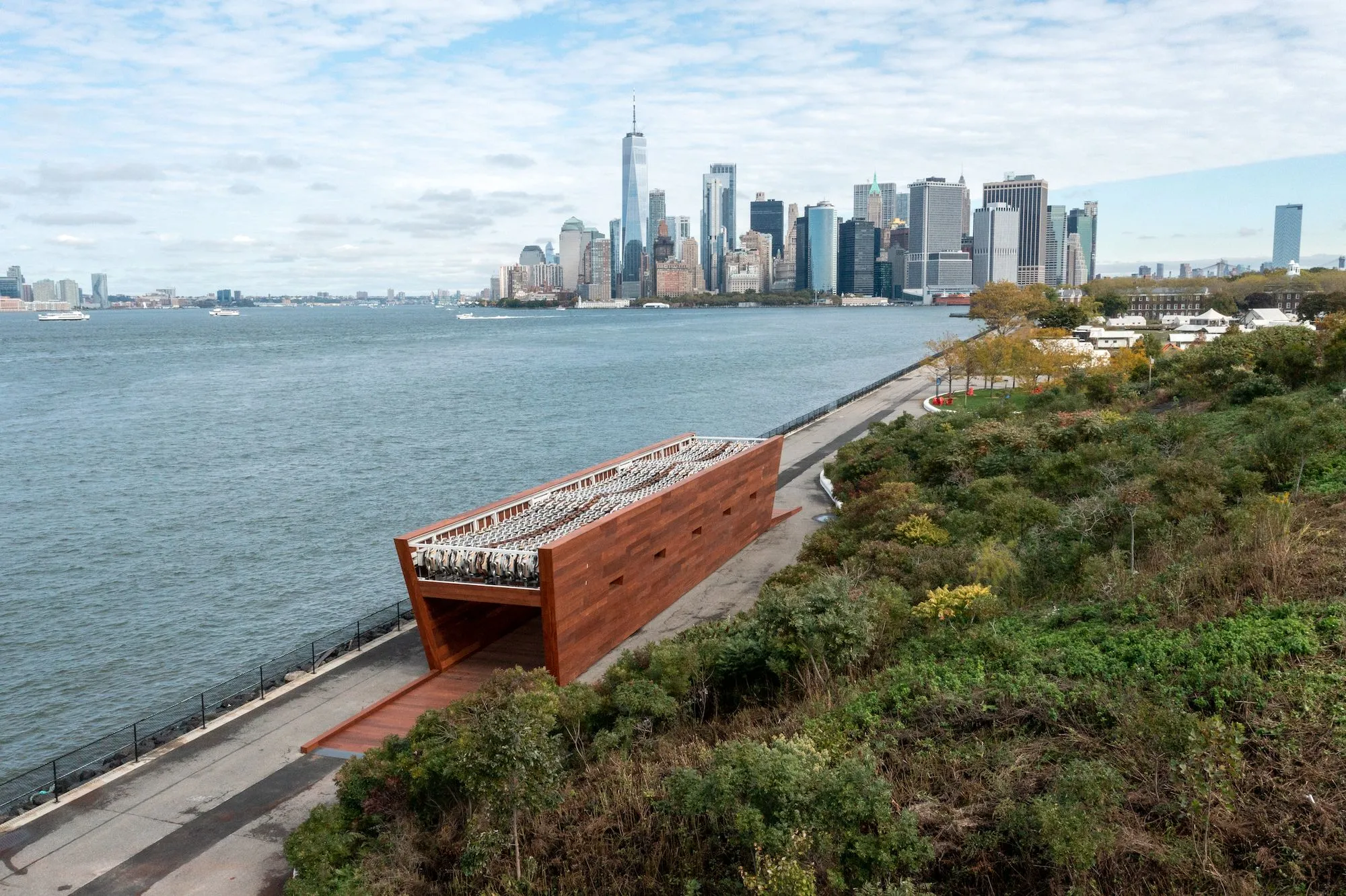 View of sculpture on governors island with lower Manhattan skyline in the background