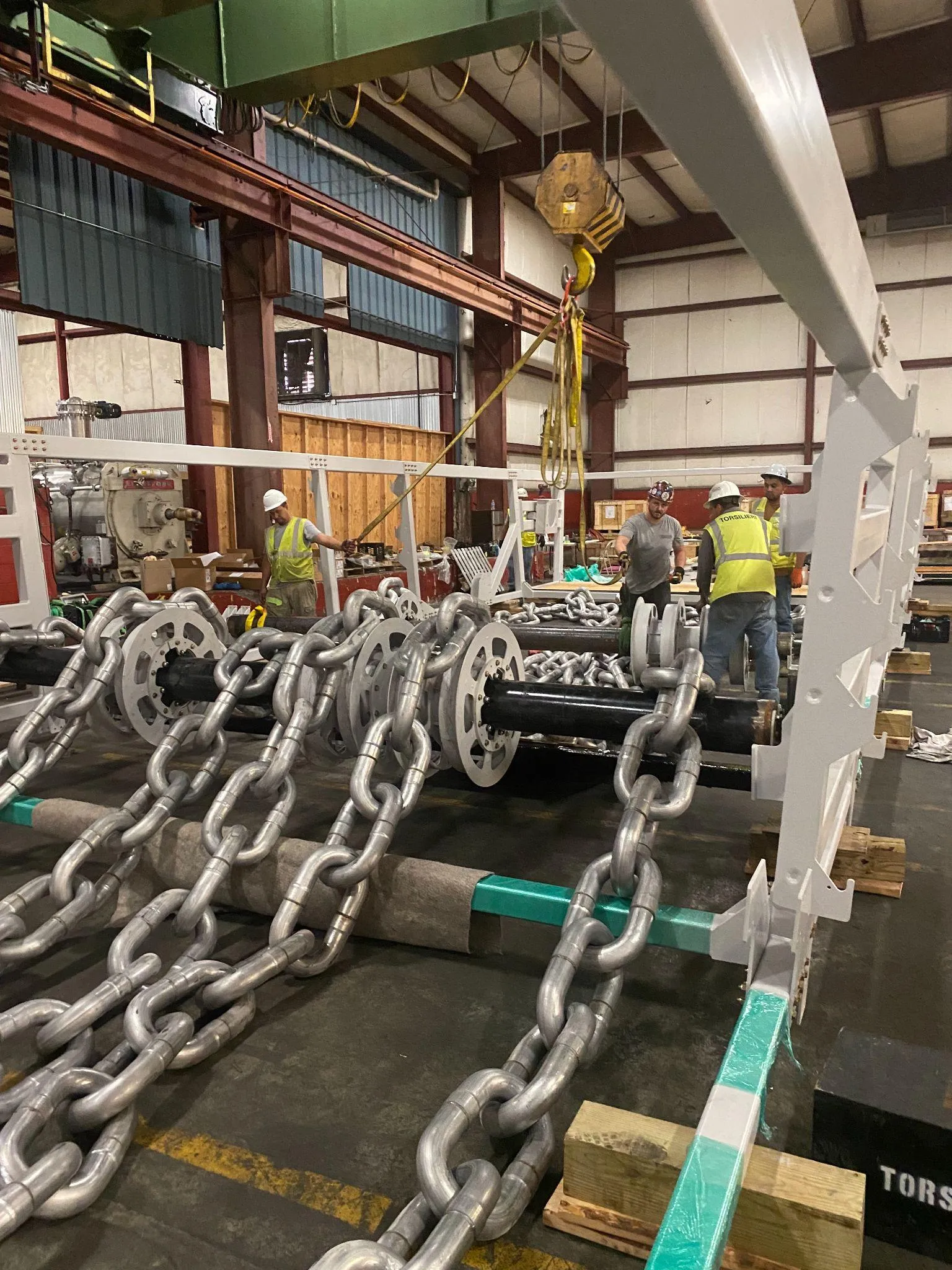 Chains for sculpture in warehouse during fabrication