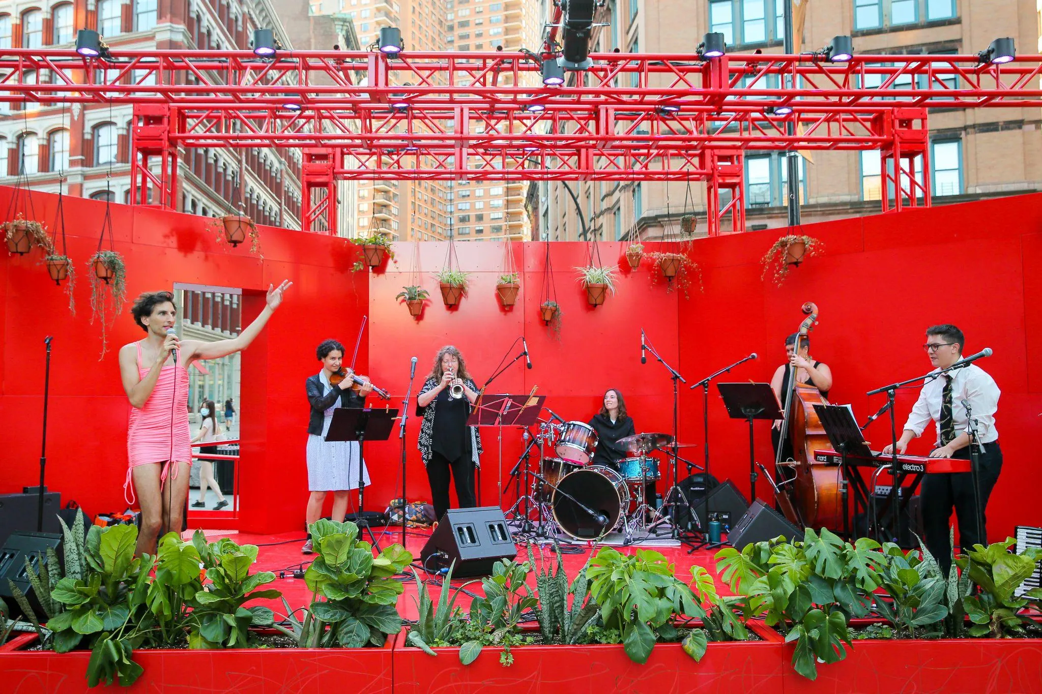Crowd viewing the stage on hot day in Astor Place